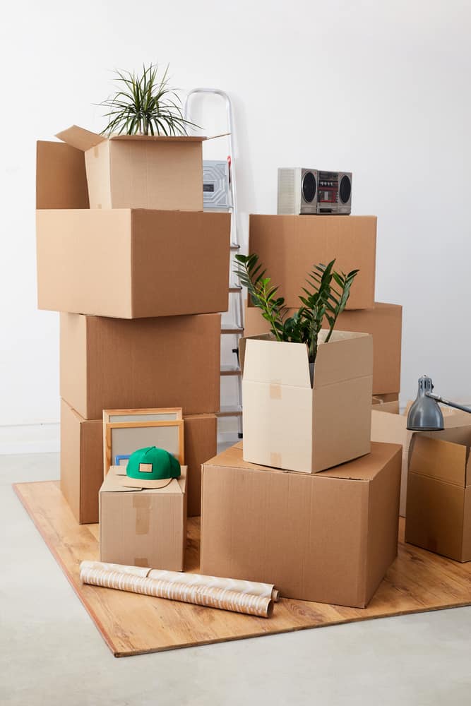 Vertical,Background,Image,Of,Cardboard,Boxes,Stacked,In,Empty,Room